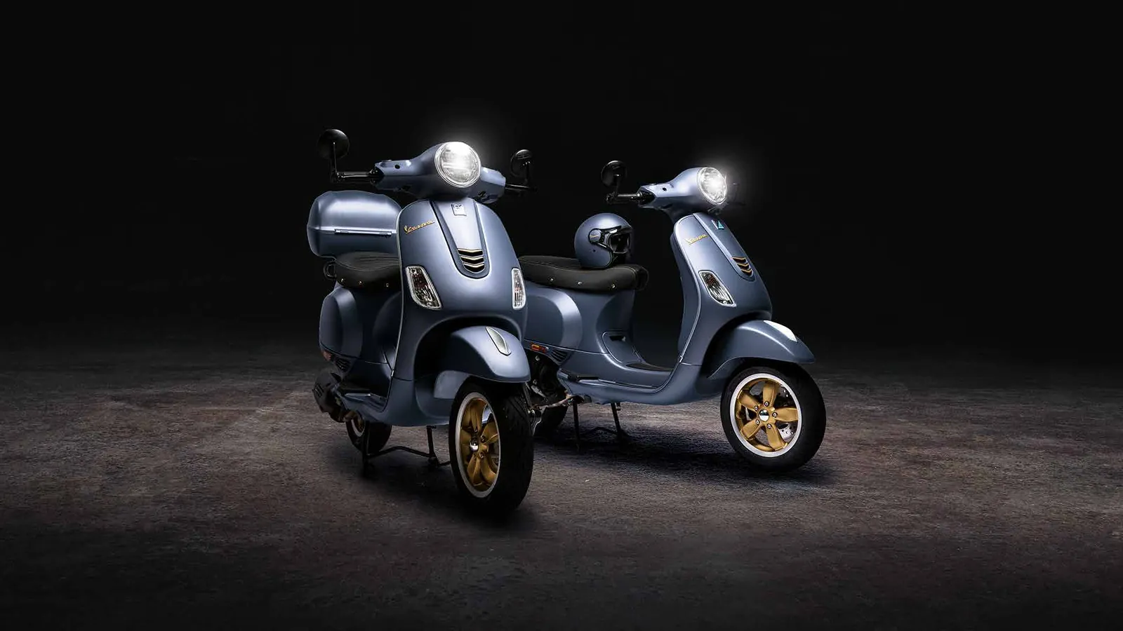 Two Vespa Officina 8 scooters in blue